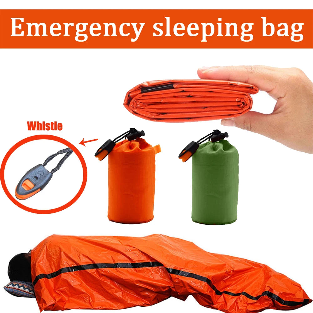 Emergency sleeping bag with whistle and storage bags on a white background